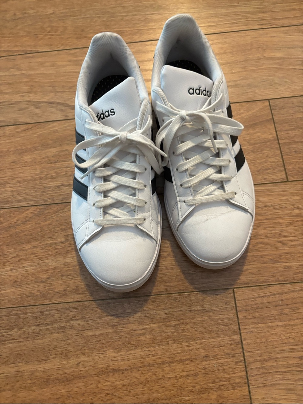Adidas Women’s size 9 White Sneakers with Black Stripes
